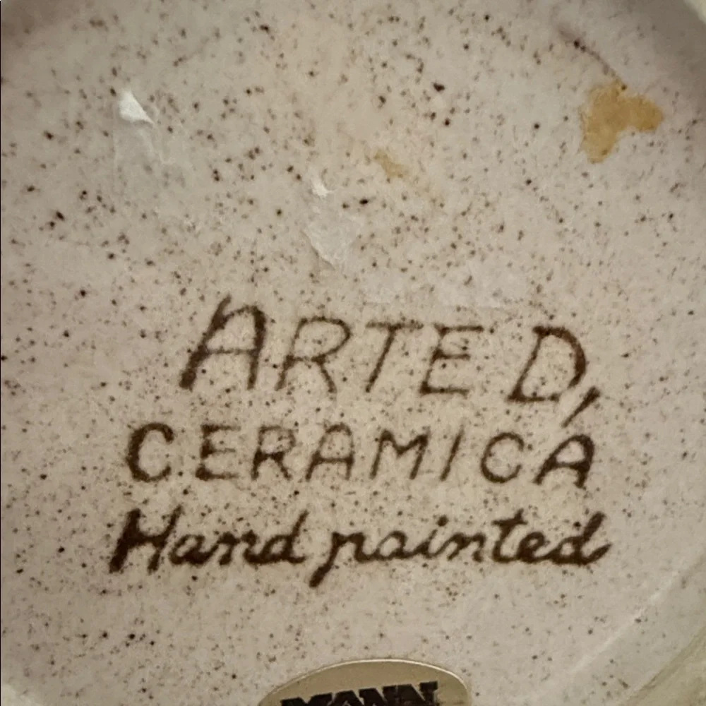This is a vintage hand-painted ceramic pitcher 1976